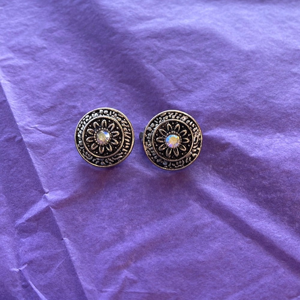 Silver plated clip on earrings.